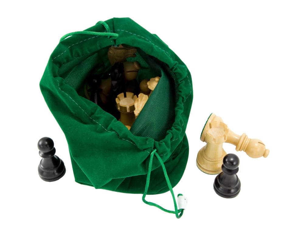 Green drawstring chess piece bag holding wooden chess pieces with pawns and a king, made from plush corded fabric for safe and elegant storage.