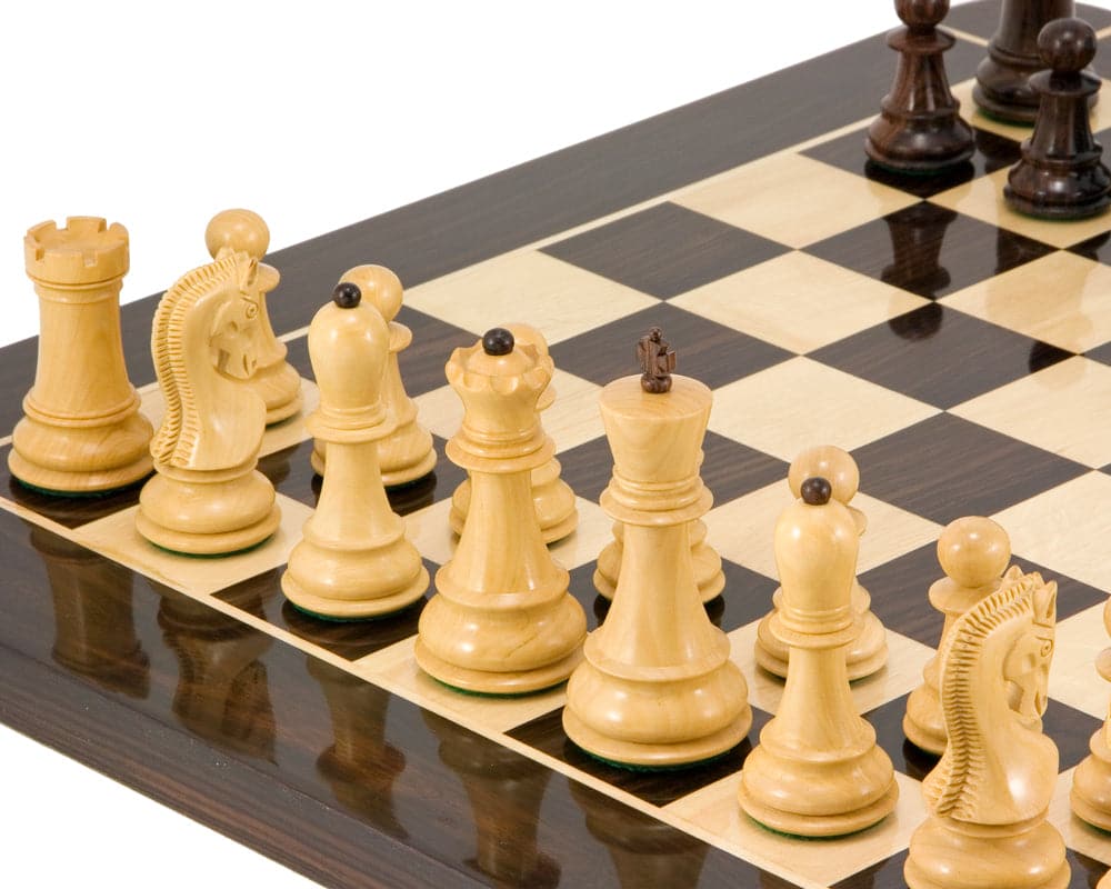 Antipodean Series Rosewood Staunton Chessmen set up on a dark grain board, showcasing the 4-inch king and weighted, felted pieces.