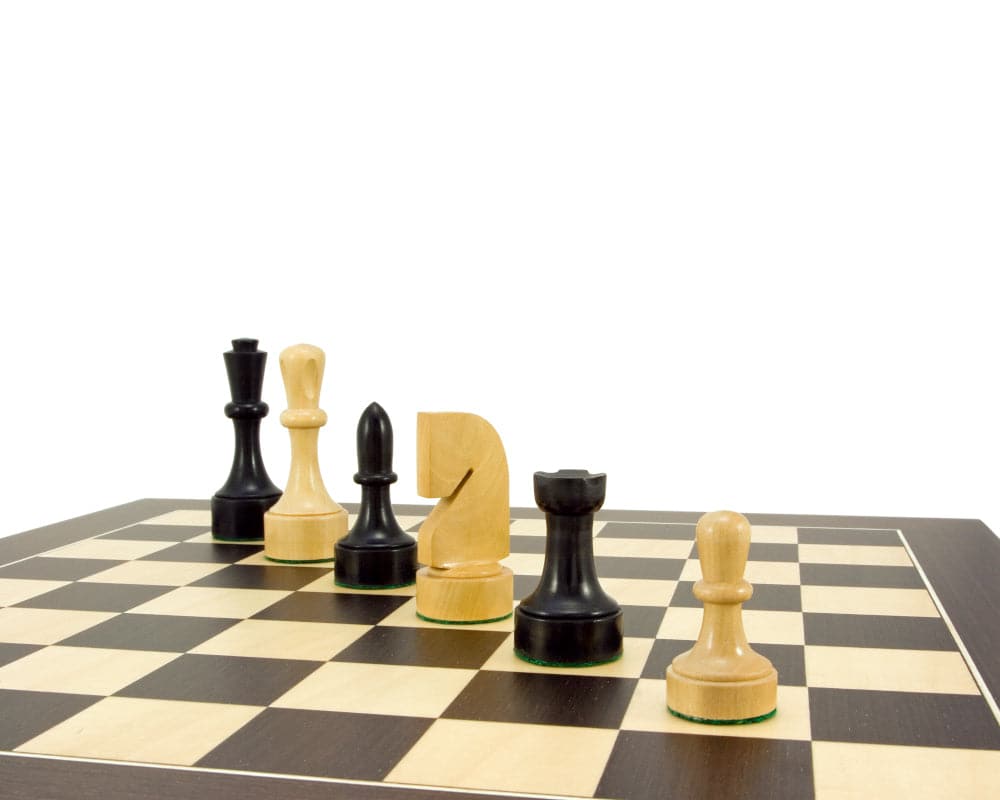 Contemporary Series ebonised chess pieces crafted in boxwood on an 18-inch board, featuring a 3.75-inch king. Weighted and felted for stability