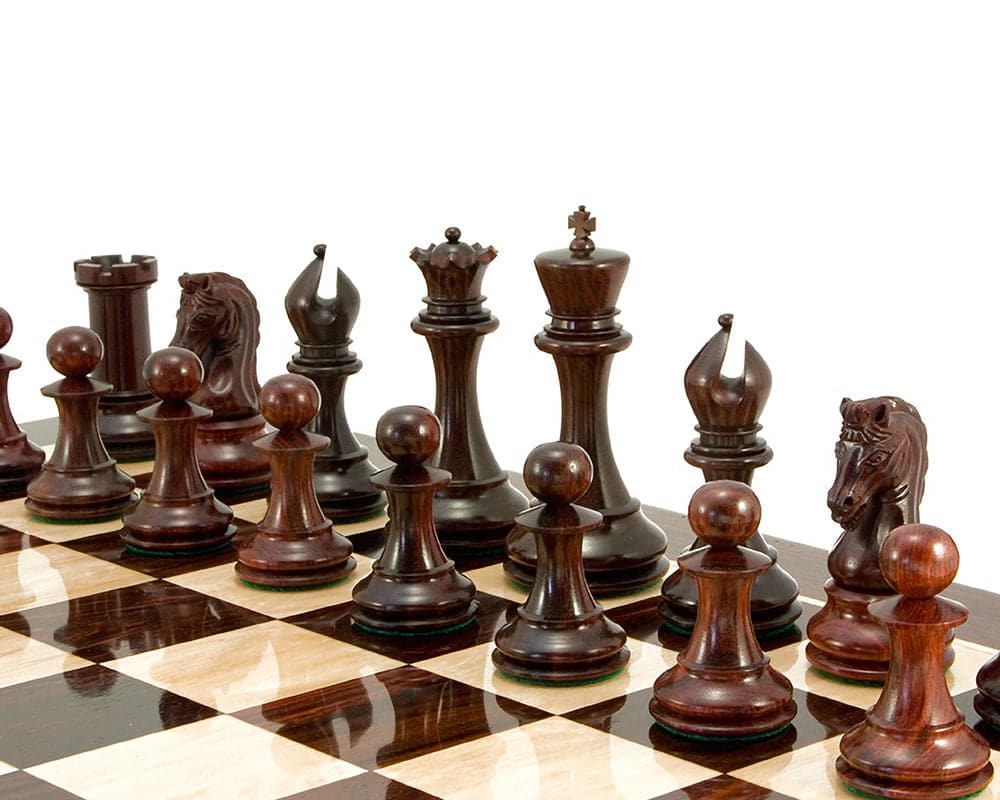 Eminence Series Rosewood Luxury Chess Pieces 4.5 Inches on a chessboard, featuring a king, additional queens, and finely crafted Staunton pieces.