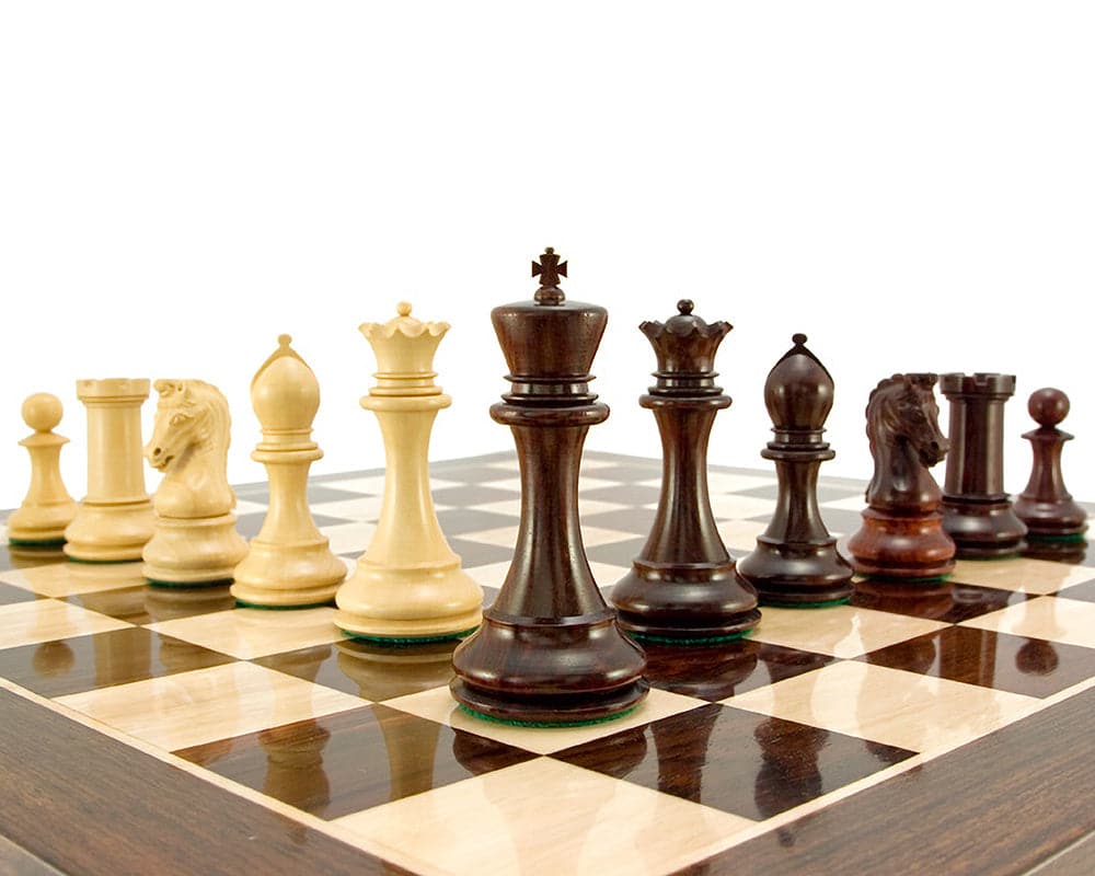 Eminence Series Rosewood Luxury Chess Pieces on a 23-inch board featuring a 4.5-inch king, weighted and covered in billiard cloth for balance.