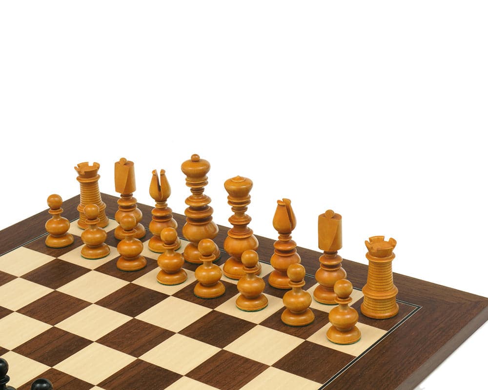 Calvert Series Antique Reproduction Chessmen arranged on a chessboard, featuring a distinctive 3.75" king.