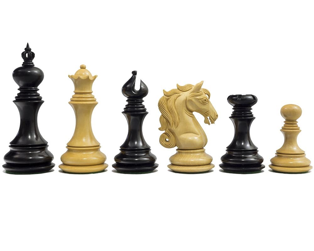 The Cavalry Series Chessmen Ebony 4.5" set showing detailed handcrafted Staunton design pieces including ornate knight and weighted for balance.