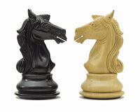 Ebony and boxwood knight chess pieces from Columbus Series, intricately carved with detailed features and a glossy finish.