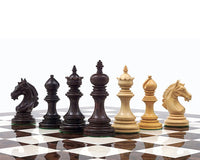 The Garvi 4 inch Rosewood Chessmen set on a 21 inch board, inspired by 16th century Indian history, featuring weighted pieces with billiard cloth bases.