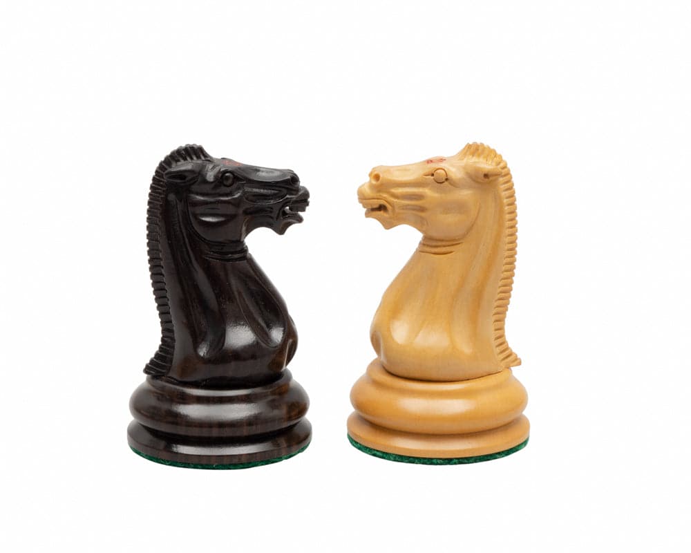 Ebony and boxwood Staunton 1849 reproduction chess knights with intricate detailing and high-quality finish.