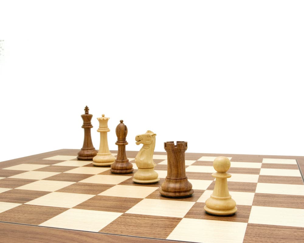 Victoria Sheesham Deluxe Staunton Chess Set on a walnut chess board featuring expertly crafted pieces.