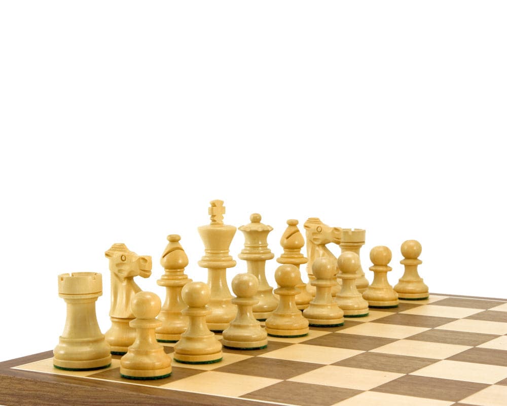 French Knight ebonised Staunton chess pieces on a walnut board with oversized playing squares