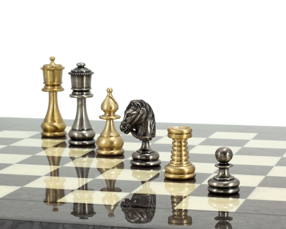 Verona Chess Set featuring brass and nickel plated brass pieces on a chessboard, expertly turned and detailed with a fine coat of lacquer