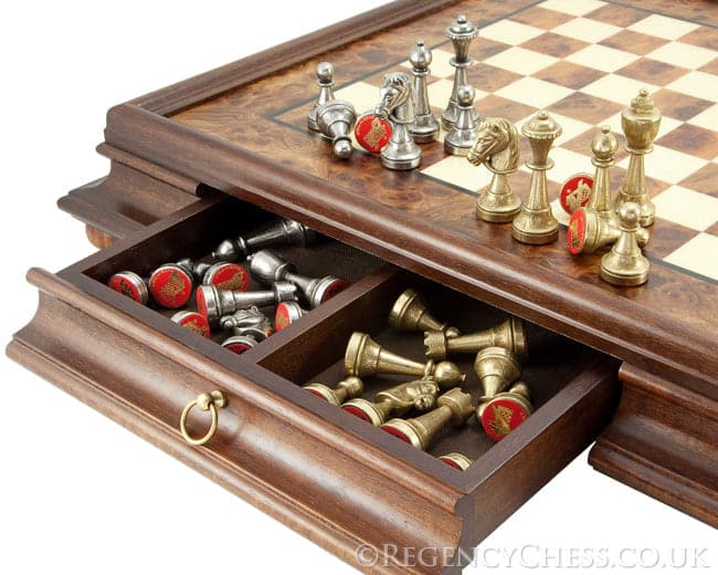 Finnesburg Brass and Nickel chess pieces on Briarwood and Elm board with drawer storing extra pieces.