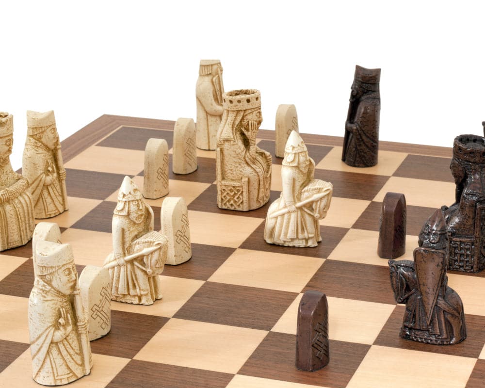 Isle of Lewis chessmen on walnut and maple chess board from National Museum Scotland