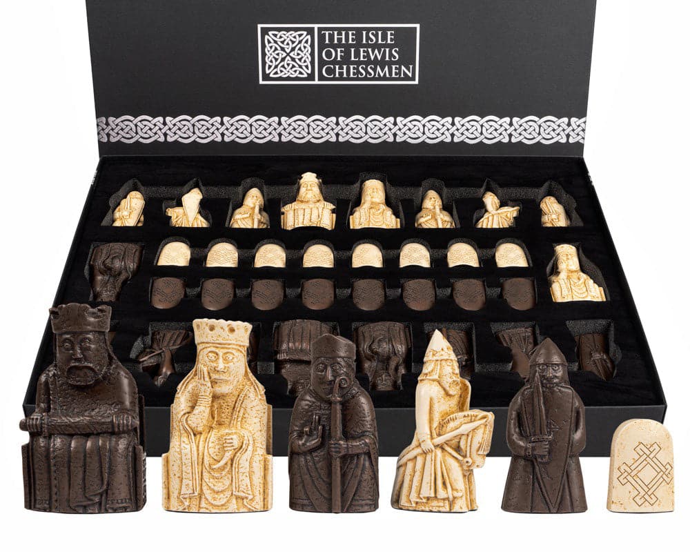 Isle of Lewis chess set with intricately designed pieces made in England and displayed in a premium case.