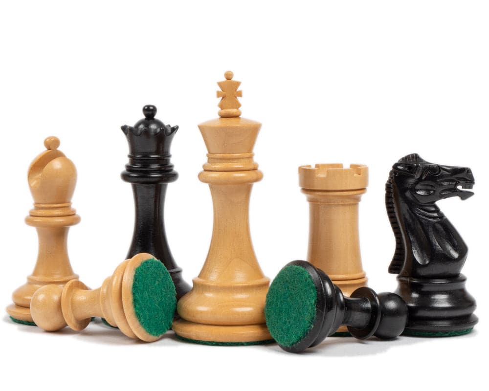 Classic Staunton chess pieces in solid ebony and boxwood, featuring a 3 inch king and bases covered with billiard cloth for perfect balance.