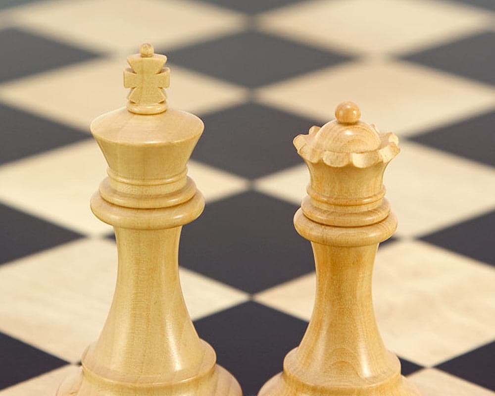 Classic Staunton king and queen on Montgoy Palisander chessboard.