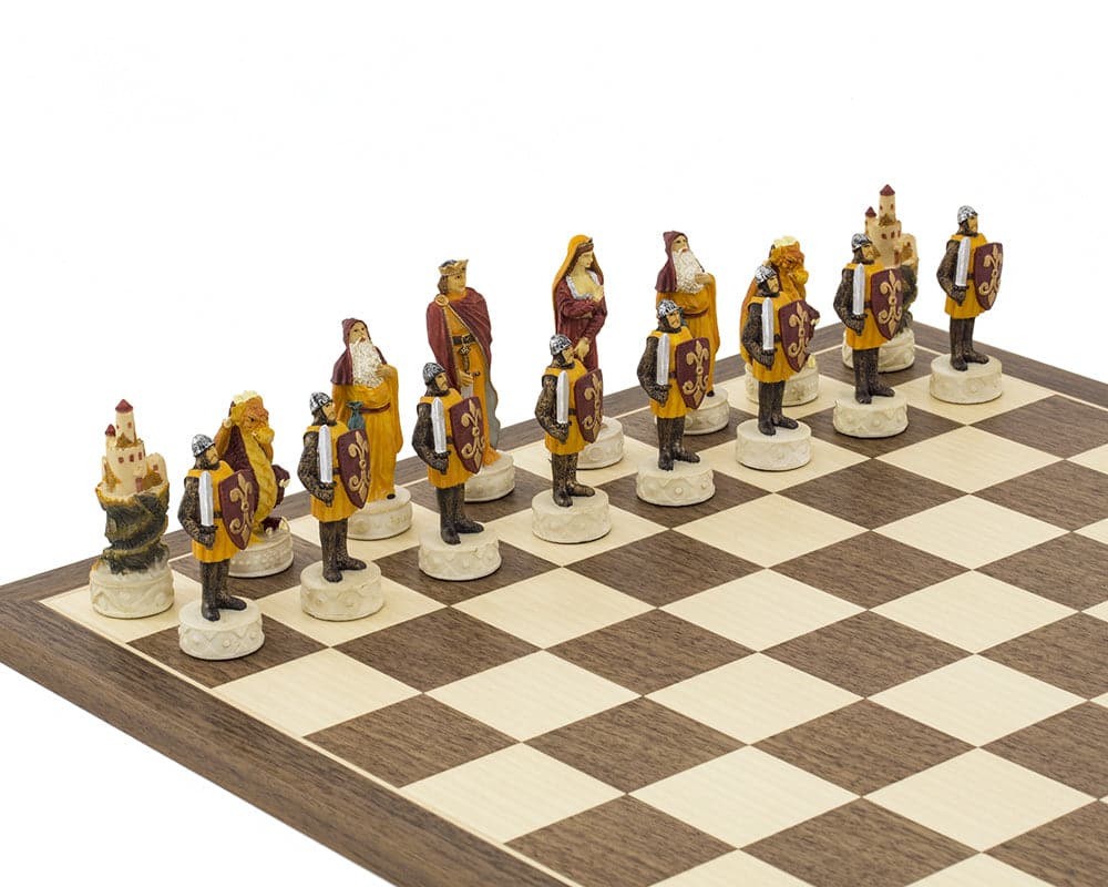 Medieval hand painted chess set on a wooden board with intricately detailed red and orange pieces, crafted in Italy.