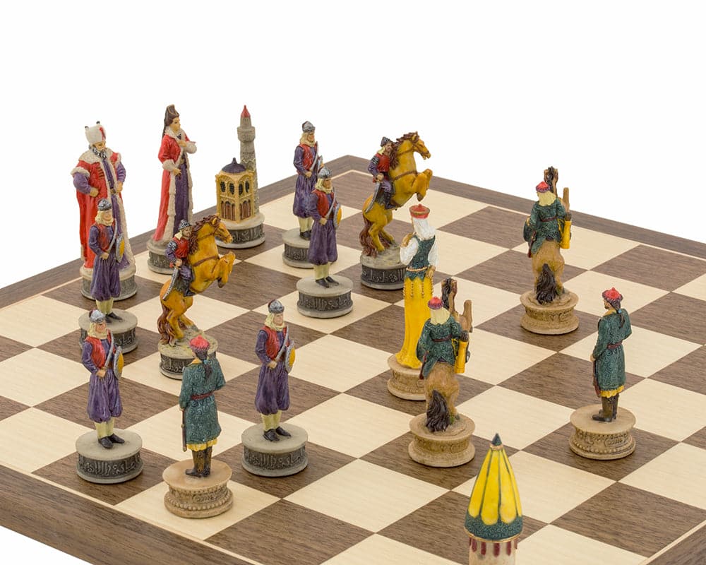 Hand painted Hungarians vs Turkish themed chess set by Italfama in play on a wooden chessboard