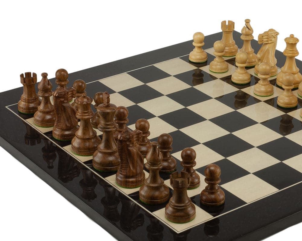 American Staunton Sheesham and Black Chess Set with elegantly crafted chess pieces on a checkered board, ready for play.