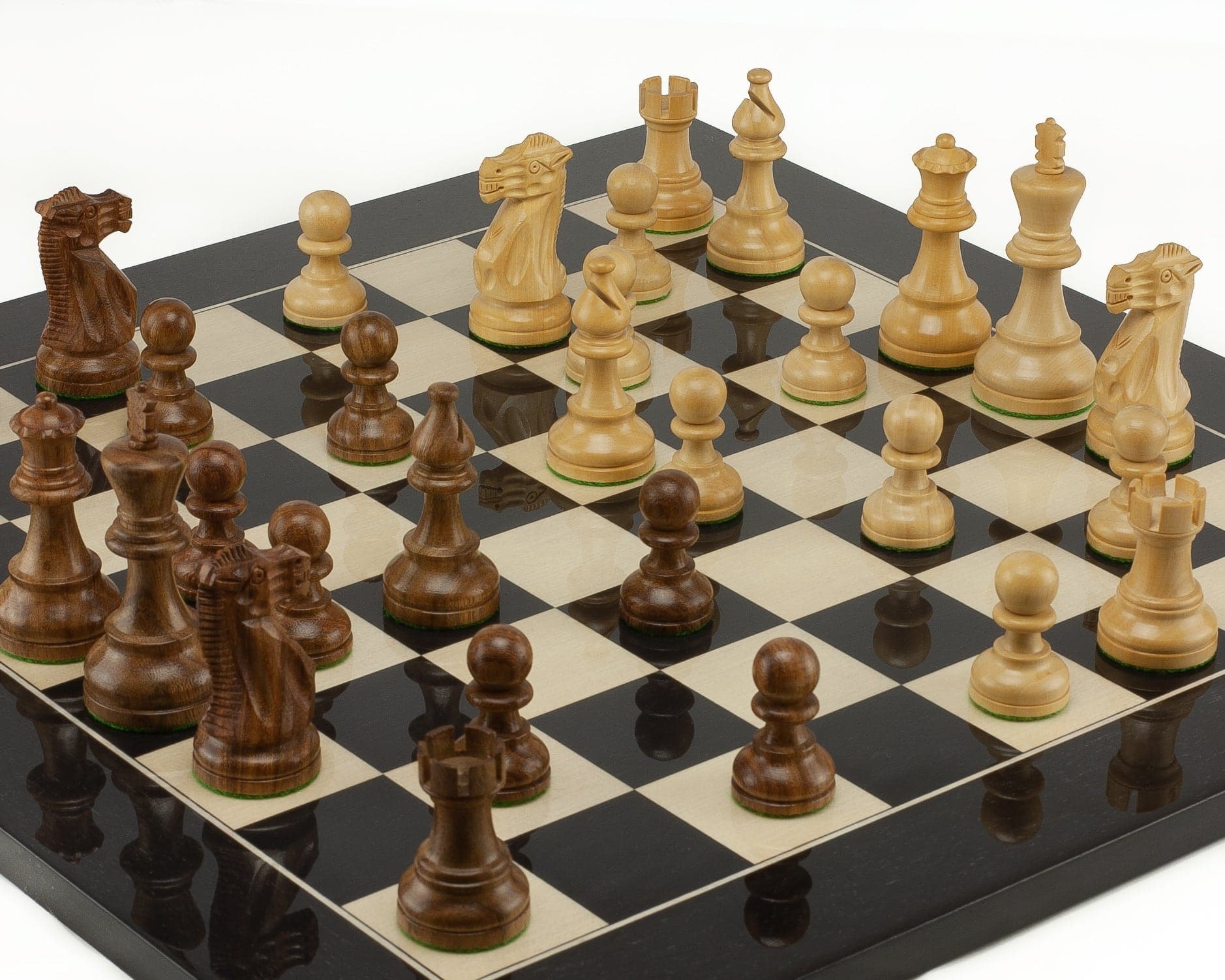 American Staunton Sheesham and Black Chess Set on the board, featuring intricately carved wooden pieces ready for play