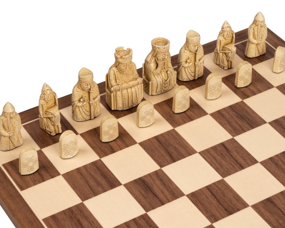 Isle of Lewis and Walnut chess set with detailed pieces on a stunning walnut chessboard, showcasing a deluxe presentation box set.