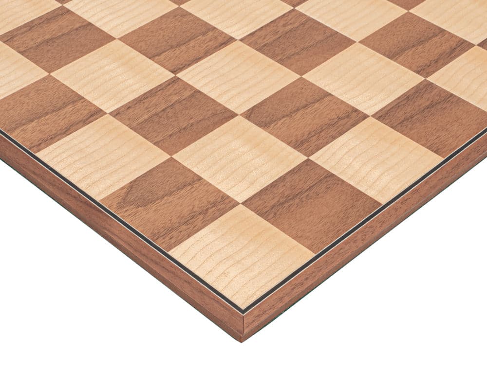 Close-up of The Conquest walnut and black folding chess set board with walnut and maple squares.