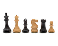 Luxury Staunton chess pieces set showcasing king, queen, bishop, knight, rook, and pawn in black and natural wood finishes.
