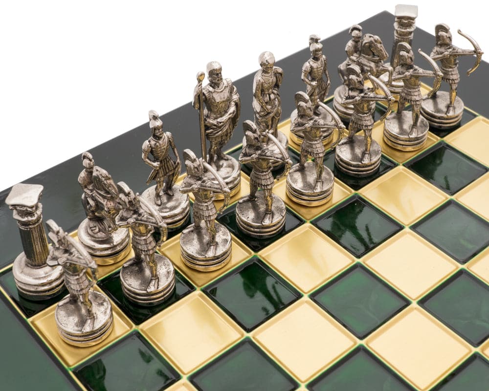 The Manopoulos Archers Chess Set with detailed metal pieces on a wooden board with green and yellow squares.